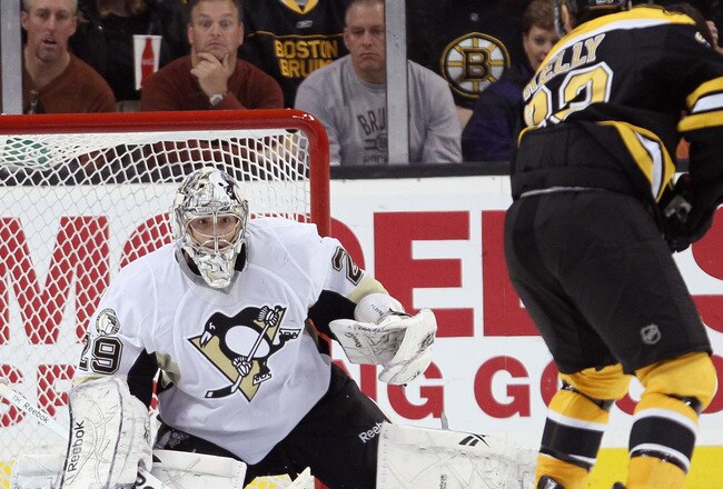 BOSTON, MA - MARCH 05: Marc-Andre Fleury #29 of the Pittsburgh Penguins stops a shot by Chris Kelly #23 of the Boston Bruins in the second period on March 5, 2011 at the TD Garden in Boston, Massachusetts.  (Photo by Elsa/Getty Images)