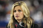 TAMPA, FL - NOVEMBER 28: ESPN commentator Erin Andrews watches play as the Georgia Tech Yellow Jackets play against the Clemson Tigers in the 2009 ACC Football Championship Game December 5, 2009 at Raymond James Stadium in Tampa, Florida.  (Photo by Al Messerschmidt/Getty Images)