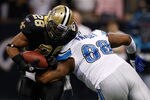 NEW ORLEANS, LA - DECEMBER 04:  Running back Mark Ingram #28 of the New Orleans Saints is hit by defensive tackle Nick Fairley #98 of the Detroit Lions in the first quarter at Mercedes-Benz Superdome on December 4, 2011 in New Orleans, Louisiana.  (Photo by Chris Graythen/Getty Images)