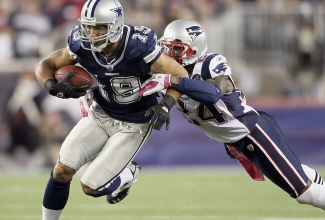FOXBORO, MA - OCTOBER 16:  Miles Austin #19 of the Dallas Cowboys carries the ball as  Kyle Arrington #24 of the New England Patriots defends on October 16, 2011 at Gillette Stadium in Foxboro, Massachusetts. The New England Patriots defeated the Dallas Cowboys 20-16.  (Photo by Elsa/Getty Images)