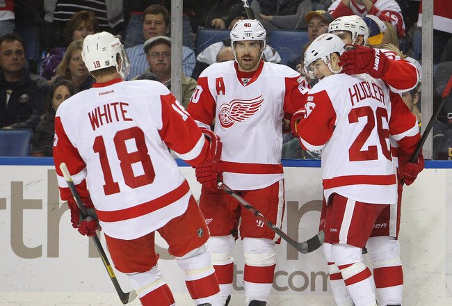 BUFFALO, NY - DECEMBER 4:  Valtteri Filppula #51 of the Detroit Red Wings celebrates his goal with Ian White #18, Henrik Zetterberg #40 and Jiri Hudler #26 during a NHL game against the Buffalo Sabres at First Niagara Center on December 2, 2011 in Buffalo, New York. (Photo by Tom Szczerbowski/Getty Images)