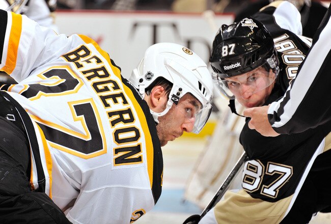 PITTSBURGH, PA - DECEMBER 5:  Patrice Bergeron #37 of the Boston Bruins and Sidney Crosby #87 of the Pittsburgh Penguins wait for the puck drop on a face off on December 5, 2011 at CONSOL Energy Center in Pittsburgh, Pennsylvania. Boston defeated Pittsburgh 3-1.  (Photo by Jamie Sabau/Getty Images)