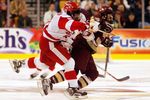 BOSTON - FEBRUARY 13 :  Stephen Gionta #15 of the Boston College Eagles is hit by Pete MacArthur #16 of the Boston University Terriers during the championship game of the 54th annual Beanpot tournament at the TD Banknorth Garden on February  13, 2006 in Boston, Massachusetts. The Terriers defeated the Eagles 3-2.(Photo by Jim McIsaac/Getty Images)