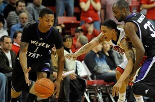 LAS VEGAS - DECEMBER 17:  Tre'Von Willis #33 of the UNLV Rebels goes for a steal between Damian Lillard #1 and Matt Washington #33 of the Weber State Wildcats during their game at the Thomas & Mack Center December 17, 2009 in Las Vegas, Nevada.  (Photo by Ethan Miller/Getty Images)