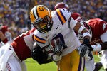 BATON ROUGE, LA - NOVEMBER 25:  Kick returner Tyrann Mathieu #7 of the LSU Tigers returns a punt for seven yards as he is tackled by Marquel Wade #1 of the Arkansas Razorbacks in the first quarter at Tiger Stadium on November 25, 2011 in Baton Rouge, Louisiana.  (Photo by Chris Graythen/Getty Images)