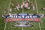 NEW ORLEANS, LA - JANUARY 04:  Dan Herron #1 of the Ohio State Buckeyes runs the ball in the first half against the Arkansas Razorbacks during the Allstate Sugar Bowl at the Louisiana Superdome on January 4, 2011 in New Orleans, Louisiana.  (Photo by Chris Graythen/Getty Images)