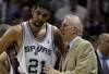 SAN ANTONIO - MAY 17:  Head coach Gregg Popovich of the San Antonio Spurs talks with Tim Duncan #21 during a timeout late in the fourth quarter against the Dallas Mavericks in Game Five of the Western Conference Semifinals during the 2006 NBA Playoffs May 17, 2006 at AT&T Center in San Antonio, Texas. The SPurs won 98-97. NOTE TO USER: User expressly acknowledges and agrees that, by downloading and or using this photograph, User is consenting to the terms and conditions of the Getty Images License Agreement.  (Photo by Stephen Dunn/Getty Images)