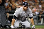 SAN FRANCISCO, CA - SEPTEMBER 27: Chris Iannetta #20 goes down to his knees after being hit with a pitch against the San Francisco Giants during an MLB baseball game at AT&T Park on September 27, 2011 in San Francisco, California.  (Photo by Thearon W. Henderson/Getty Images)