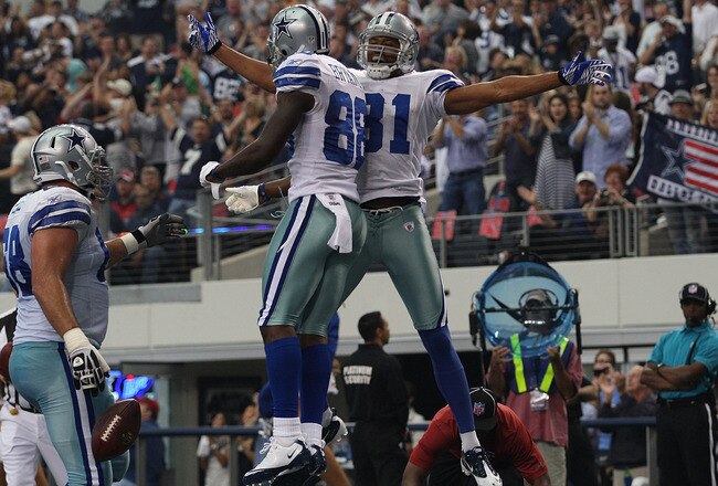 ARLINGTON, TX - NOVEMBER 13:  Laurent Robinson #81 of the Dallas Cowboys celebrates his touchdown with Dez Bryant #88 against the Buffalo Bills at Cowboys Stadium on November 13, 2011 in Arlington, Texas.  (Photo by Ronald Martinez/Getty Images)
