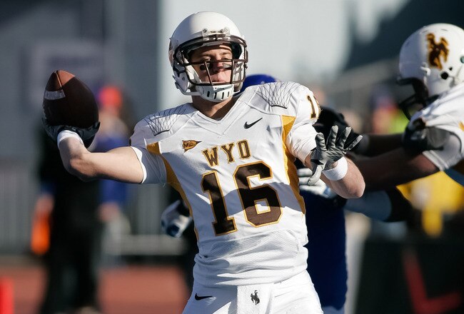 BOISE, ID - NOVEMBER 26: Brett Smith #16 of the Wyoming Cowboys passes against the Boise State Broncos at Bronco Stadium on November 26, 2011 in Boise, Idaho.  (Photo by Otto Kitsinger III/Getty Images)