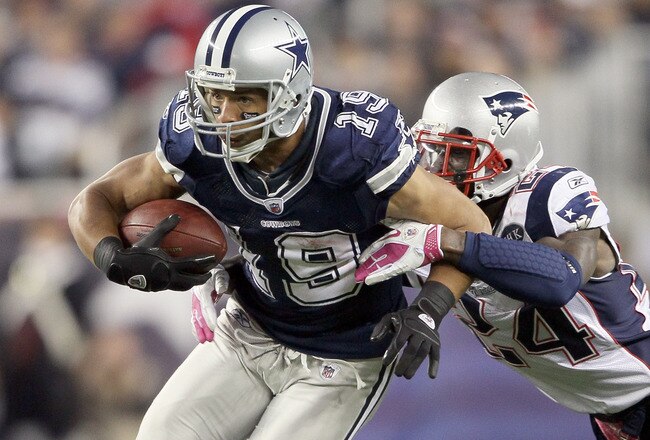 FOXBORO, MA - OCTOBER 16:  Miles Austin #19 of the Dallas Cowboys carries the ball as  Kyle Arrington #24 of the New England Patriots defends on October 16, 2011 at Gillette Stadium in Foxboro, Massachusetts. The New England Patriots defeated the Dallas Cowboys 20-16.  (Photo by Elsa/Getty Images)