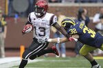 ANN ARBOR, MI - SEPTEMBER 24: Ronnie Hillman #13 of San Diego State runs for a first down as Jordan Kovacs #32 of the Michigan Wolverines attempts to make the stop runs during the first half of the game at Michigan Stadium on September 24, 2011 in Ann Arbor, Michigan.  (Photo by Leon Halip/Getty Images)