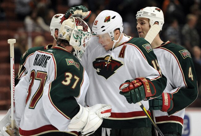 ANAHEIM, CA - DECEMBER 04:  Dany Heatley #15 of the Minnesota Wild celebrates a 5-3 win with Josh Harding #37 and Clayton Stoner #4 over the Anaheim Ducks at Honda Center on December 4, 2011 in Anaheim, California.  (Photo by Harry How/Getty Images)