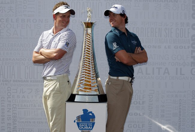 DUBAI, UNITED ARAB EMIRATES - DECEMBER 06:  Luke Donald of England and Rory McIlroy of Northern Ireland pictured with the Race to Dubai trophy during the pro-am event prior to the Dubai World Championships on the Earth Course at Jumeirah Golf Estates on December 6, 2011 in Dubai, United Arab Emirates.  (Photo by Ross Kinnaird/Getty Images)