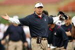 LOS ANGELES - DECEMBER 5: Head coach Mike Stoops of the Arizona Wildcats gestrures to an official during the game with the USC Trojans on December 5, 2009 at the Los Angeles Coliseum in Los Angeles, California.   (Photo by Stephen Dunn/Getty Images)
