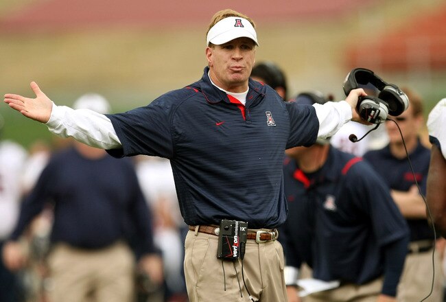 LOS ANGELES - DECEMBER 5: Head coach Mike Stoops of the Arizona Wildcats gestrures to an official during the game with the USC Trojans on December 5, 2009 at the Los Angeles Coliseum in Los Angeles, California.   (Photo by Stephen Dunn/Getty Images)