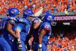BOISE, ID - OCTOBER 01:  Doug Martin #22 of the Boise State Broncos is congratulated by his teammates for a touchdown against the Nevada Wolf Pack at Bronco Stadium on October 1, 2011 in Boise, Idaho.  (Photo by Otto Kitsinger III/Getty Images)