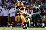 LANDOVER, MD - OCTOBER 16:  Santana Moss #89 of the Washington Redskins avoids a tackle by  Ronnie Brown #21 of the Philadelphia Eagles during a game at FedExField on October 16, 2011 in Landover, Maryland.  (Photo by Patrick McDermott/Getty Images)
