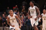NEW YORK, NY - DECEMBER 06:  Jae Crowder #32 and Vander Blue #2 of the Marquette Golden Eagles celebrate defeating the Washington Huskies during the Jimmy V Men's Basketball Classic at Madison Square Garden on December 6, 2011 in New York City.  (Photo by Nick Laham/Getty Images)