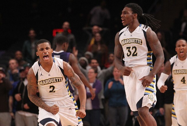 NEW YORK, NY - DECEMBER 06:  Jae Crowder #32 and Vander Blue #2 of the Marquette Golden Eagles celebrate defeating the Washington Huskies during the Jimmy V Men's Basketball Classic at Madison Square Garden on December 6, 2011 in New York City.  (Photo by Nick Laham/Getty Images)