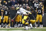 IOWA CITY, IA - NOVEMBER 5: Broderick Binns #91 of the Iowa Hawkeyes sacks Devin Gardner #7 of the Michigan Wolverines at Kinnick Stadium on November 5, 2011 in Iowa City, Iowa. Iowa won 24-16. (Photo by Joe Robbins/Getty Images)
