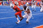 BOISE, ID - NOVEMBER 12:  Josh Boyce #82 of the TCU Horned Frogs pulls away from Quaylon Ewing-Burton #26 of the Boise State Broncos to score a two point conversion against the Boise State Broncos at Bronco Stadium on November 12, 2011 in Boise, Idaho.  The Horned Frogs won 36-35. (Photo by Otto Kitsinger III/Getty Images)