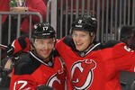 NEWARK, NJ - NOVEMBER 26:  Adam Larsson #5 of the New Jersey Devils celebrates his goal with Ilya Kovalchuk #17 against the New York Islanders during their game on November 26, 2011 at The Prudential Center in Newark, New Jersey.  (Photo by Al Bello/Getty Images)