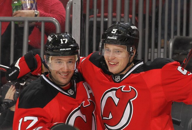 NEWARK, NJ - NOVEMBER 26:  Adam Larsson #5 of the New Jersey Devils celebrates his goal with Ilya Kovalchuk #17 against the New York Islanders during their game on November 26, 2011 at The Prudential Center in Newark, New Jersey.  (Photo by Al Bello/Getty Images)