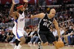 LOS ANGELES, CA - DECEMBER 01:  Richard Jefferson #24 of the San Antonio Spurs dribbles around Baron Davis #5 of the Los Angeles Clippers at the Staples Center on December 1, 2010 in Los Angeles, California.  NOTE TO USER: User expressly acknowledges and agrees that, by downloading and or using this photograph, User is consenting to the terms and conditions of the Getty Images License Agreement.  (Photo by Harry How/Getty Images)