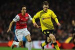 LONDON, ENGLAND - NOVEMBER 23: Lukasz Piszczek of Dortmund and Yossi Benayoun of Arsenal fight for the ball during the UEFA Champions League Group F match between Arsenal FC and Borussia Dortmund  at Emirates Stadium on November 23, 2011 in London, England.  (Photo by Mike Hewitt/Getty Images)
