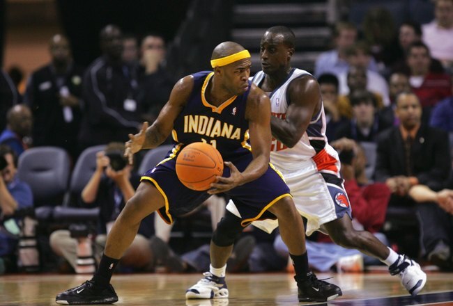 CHARLOTTE, NC - NOVEMBER 1:  Jamaal Tinsley #11 of the Indiana Pacers moves around Brevin Knight #22 of the Charlotte Bobcats during the game on November 1, 2006 at the Charlotte Bobcats Arena in Charlotte, North Carolina.  The Pacers won 106-99.  NOTE TO USER: User expressly acknowledges and agrees that, by downloading and or using this photograph, User is consenting to the terms and conditions of the Getty Images License Agreement.  (Photo by Streeter Lecka/Getty Images)
