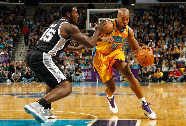 NEW ORLEANS, LA - JANUARY 22:  David West #30 of the New Orleans Hornets drives the ball around DeJuan Blair #45 of the San Antonio Spurs at the New Orleans Arena on January 22, 2011 in New Orleans, Louisiana.  NOTE TO USER: User expressly acknowledges and agrees that, by downloading and/or using this photograph, User is consenting to the terms and conditions of the Getty Images License Agreement.  (Photo by Chris Graythen/Getty Images)