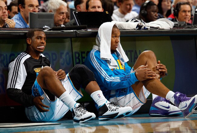 NEW ORLEANS, LA - DECEMBER 26:  Chris Paul #3 and David West #30 of the New Orleans Hornets sit on the floor before being substituted into the game while playing the Atlanta Hawks at the New Orleans Arena on December 26, 2010 in New Orleans, Louisiana.  NOTE TO USER: User expressly acknowledges and agrees that, by downloading and or using this photograph, User is consenting to the terms and conditions of the Getty Images License Agreement.  (Photo by Chris Graythen/Getty Images)