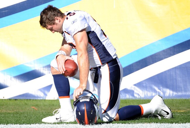 SAN DIEGO, CA - NOVEMBER 27:  Tim Tebow #15 of the Denver Broncos prays before the game against the San Diego Chargers at Qualcomm Stadium on November 27, 2011 in San Diego, California.  The Broncos went on to win 16-13 in overtime.  (Photo by Harry How/Getty Images)