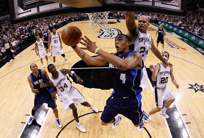 SAN ANTONIO - APRIL 29:  Forward Caron Butler #4 of the Dallas Mavericks takes a shot against Richard Jefferson #24 of the San Antonio Spurs in Game Six of the Western Conference Quarterfinals during the 2010 NBA Playoffs at AT&T Center on April 29, 2010 in San Antonio, Texas. NOTE TO USER: User expressly acknowledges and agrees that, by downloading and or using this photograph, User is consenting to the terms and conditions of the Getty Images License Agreement.  (Photo by Ronald Martinez/Getty Images)