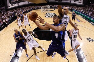 SAN ANTONIO - APRIL 29:  Forward Caron Butler #4 of the Dallas Mavericks takes a shot against Richard Jefferson #24 of the San Antonio Spurs in Game Six of the Western Conference Quarterfinals during the 2010 NBA Playoffs at AT&T Center on April 29, 2010 in San Antonio, Texas. NOTE TO USER: User expressly acknowledges and agrees that, by downloading and or using this photograph, User is consenting to the terms and conditions of the Getty Images License Agreement.  (Photo by Ronald Martinez/Getty Images)