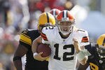 PITTSBURGH - OCTOBER 17: Colt McCoy #12 of the Cleveland Browns looks for running room while playing the Pittsburgh Steelers on October 17, 2010 at Heinz Field in Pittsburgh, Pennsylvania.  (Photo by Gregory Shamus/Getty Images)
