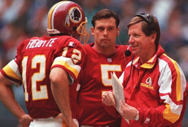 28 Nov 1996: Head coach Norv Turner (right) talks with quarterbacks Gus Frerotte (left) and Heath Shuler (middle) of the Washington Redskins during a 21-10 loss to the Dallas Cowboys at Texas Stadium in Irving, Texas.