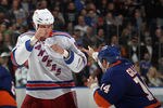 UNIONDALE, NY - DECEMBER 02: Derek Boogaard #94 of the New York Rangers fights with Trevor Gillies #14 of the New York Islanders at the Nassau Coliseum on December 2, 2010 in Uniondale, New York.  (Photo by Bruce Bennett/Getty Images)