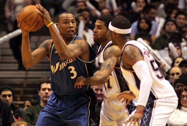 EAST RUTHERFORD, NJ - JANUARY 29:  Caron Butler #3 of the Washington Wizards controls the ball against Chris Douglas-Roberts #17 of the New Jersey Nets at the Izod Center on January 29, 2010 in East Rutherford, New Jersey. The Wizards defeated the Nets 81-79.NOTE TO USER: User expressly acknowledges and agrees that, by downloading and or using this photograph, User is consenting to the terms and conditions of the Getty Images License Agreement.  (Photo by Jim McIsaac/Getty Images)