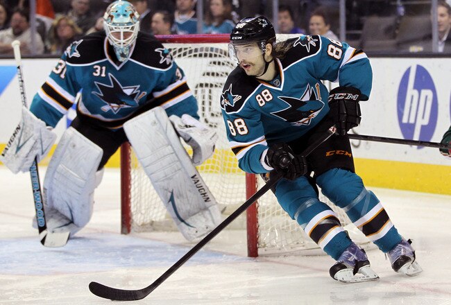 SAN JOSE, CA - DECEMBER 06:  Brent Burns #88 of the San Jose Sharks skates away from Cal Clutterbuck #22 of the Minnesota Wild at HP Pavilion at San Jose on December 6, 2011 in San Jose, California.  (Photo by Ezra Shaw/Getty Images)
