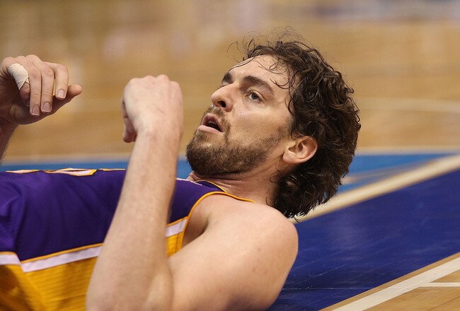 DALLAS, TX - MAY 08:  Forward Pau Gasol #16 of the Los Angeles Lakers on the ground after a foul by the Dallas Mavericks in Game Four of the Western Conference Semifinals during the 2011 NBA Playoffs on May 8, 2011 at American Airlines Center in Dallas, Texas.  NOTE TO USER: User expressly acknowledges and agrees that, by downloading and or using this photograph, User is consenting to the terms and conditions of the Getty Images License Agreement.  (Photo by Ronald Martinez/Getty Images)