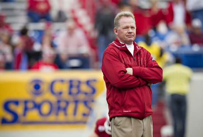 LITTLE ROCK, AR - NOVEMBER 19:   Head Coach Bobby Petrino and the Arkansas Razorbacks watches his team warm up before a game against the Mississippi State Bulldogs at War Memorial Stadium on November 19, 2011 in Little Rock, Arkansas. The Razorbacks defeated the Bulldogs 44-17.  (Photo by Wesley Hitt/Getty Images)
