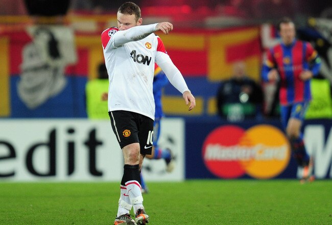 BASEL, SWITZERLAND - DECEMBER 07:  Wayne Rooney of Manchester United walks dejected after Basel scored their second goal during the UEFA Champions League Group C match between FC Basel 1893 and Manchester United at St. Jakob-Park on December 7, 2011 in Basel, Switzerland.  (Photo by Jamie McDonald/Getty Images)