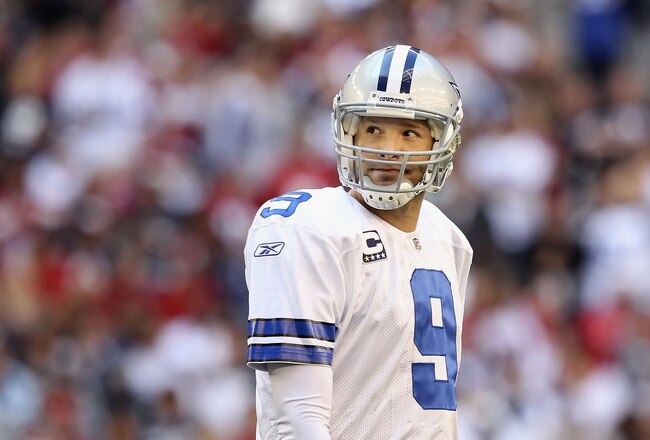 GLENDALE, AZ - DECEMBER 04:  Quarterback Tony Romo #9 of the Dallas Cowboys looks up as he walks off the field during the NFL game against the Arizona Cardinals at the University of Phoenix Stadium on December 4, 2011 in Glendale, Arizona. The Cardinals defeated the Cowboys 19-13 in overtime.  (Photo by Christian Petersen/Getty Images)