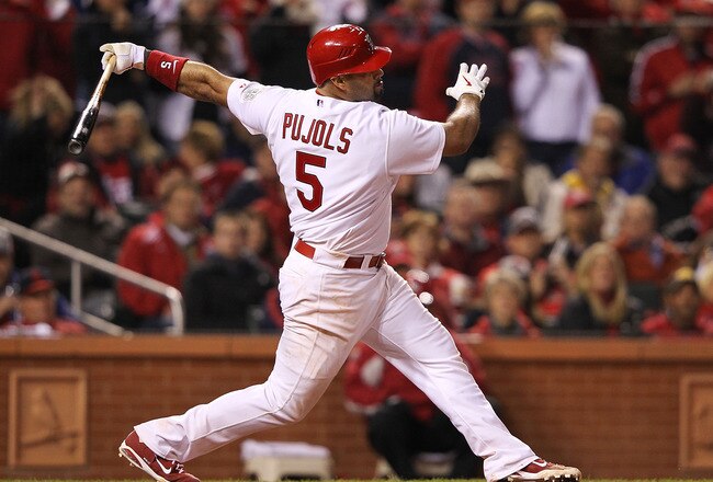 ST LOUIS, MO - OCTOBER 28:  Albert Pujols #5 of the St. Louis Cardinals strikes out in the seventh inning during Game Seven of the MLB World Series against the Texas Rangers at Busch Stadium on October 28, 2011 in St Louis, Missouri.  (Photo by Jamie Squire/Getty Images)
