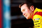 TALLADEGA, AL - OCTOBER 21:  Kurt Busch, driver of the #22 Shell/Pennzoil Dodge, stands in the garage area during practice for the NASCAR Sprint Cup Series Good Sam Club 500 at Talladega Superspeedway on October 21, 2011 in Talladega, Alabama.  (Photo by Jeff Zelevansky/Getty Images for NASCAR)
