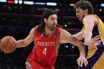 LOS ANGELES, CA - FEBRUARY 01:  Luis Scola #4 of the Houston Rockets is defended by Pau Gasol #16 of the Los Angeles Lakers in the second half at Staples Center on February 1, 2011 in Los Angeles, California. The Lakers defeated the Rockets 114-106. NOTE TO USER: User expressly acknowledges and agrees that, by downloading and or using this photograph, User is consenting to the terms and conditions of the Getty Images License Agreement.  (Photo by Jeff Gross/Getty Images)
