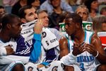 NEW ORLEANS - NOVEMBER 13:  Emeka Okafor #50, Peja Stojakovic #16 and Chris Paul #3 of the New Orleans Hornets talk on the bench during the game against the Portland Trail Blazers at the New Orleans Arena on November 13, 2009 in New Orleans, Louisiana.  NOTE TO USER: User expressly acknowledges and agrees that, by downloading and/or using this Photograph, User is consenting to the terms and conditions of the Getty Images License Agreement.  (Photo by Chris Graythen/Getty Images)
