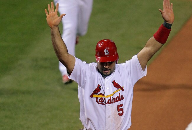 ST LOUIS, MO - OCTOBER 28:  Albert Pujols #5 of the St. Louis Cardinals scores on a two-run double by David Freese #23 in the first inning during Game Seven of the MLB World Series against the Texas Rangers at Busch Stadium on October 28, 2011 in St Louis, Missouri.  (Photo by Doug Pensinger/Getty Images)